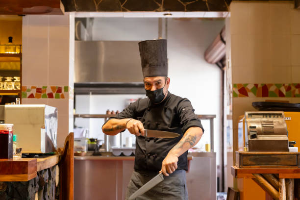 istock Chef with knives in the kitchen 2155094435