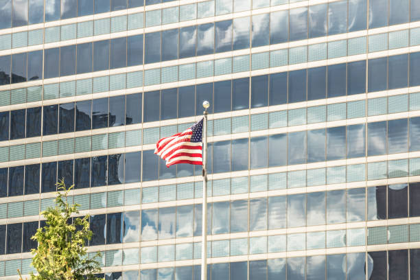 American flag flying in front of office building, Chicago, Illinois.