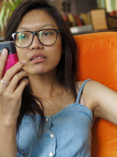istock asian women looking on the mobile phone angrily 2155096619