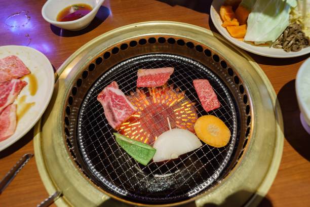 istock fresh meat and vegetable on grill charcoal stove at restaurant 2155096896