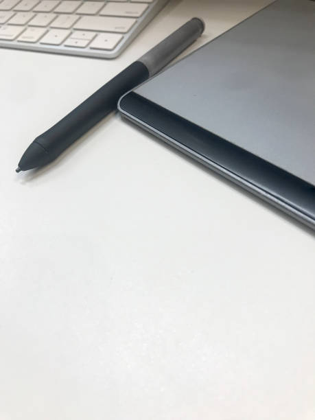 graphic design desk hand using mouse pan sketch device on creative desk.
