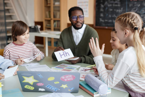 istock Girl Raising Hand In English Class 2155097503