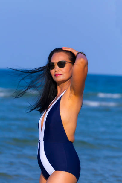 istock Woman body beautiful with bikini relax on beach 2155097529