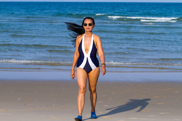 istock Woman body beautiful with bikini relax on beach 2155097536