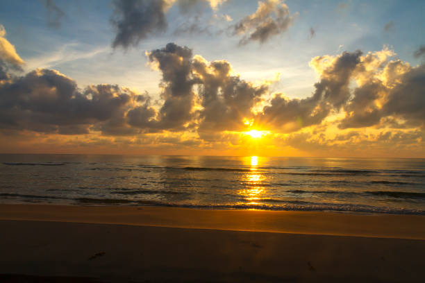 Sunrise on water in morning at beach Hat Ban Krut Prachuap Khiri Khan Province in Thailand is famous for travel and relax
