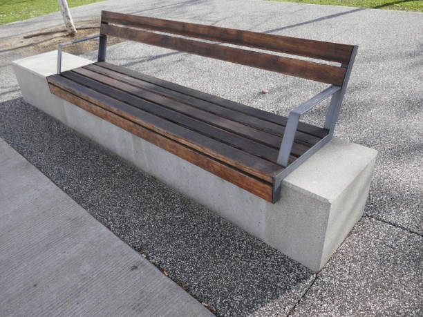 istock Modern wood metal and concrete park bench outside 2155098009