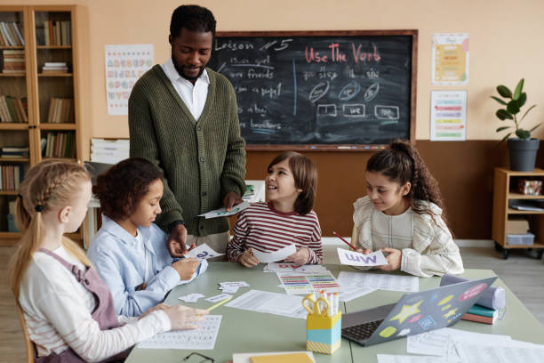 istock African American Teacher Working With Kids 2155100780