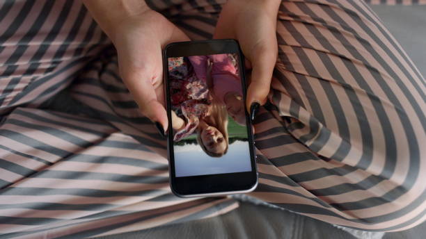 istock Closeup hands calling smartphone online. Unknown woman talking web resting home 2155104758