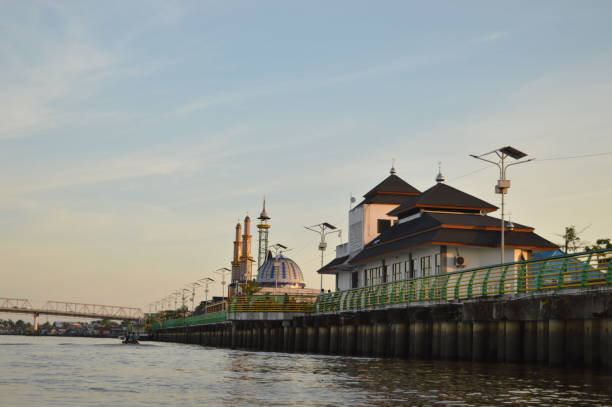pontianak waterfront with a green fence and clear sky