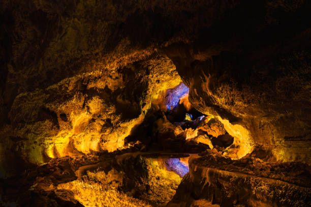 Discover the underground marvel of Cueva de los Verdes in Lanzarote, a stunning reflection in the volcanic tunnel waters, perfect for captivating imagery.
