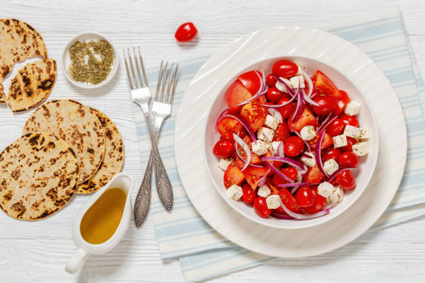 tomato salad with red onion and white cheese