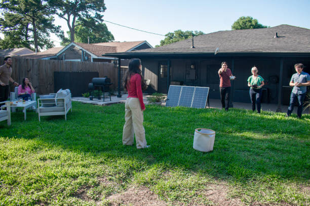 istock sustainable multigenerational family plays bean bag toss in back yard 2155108624