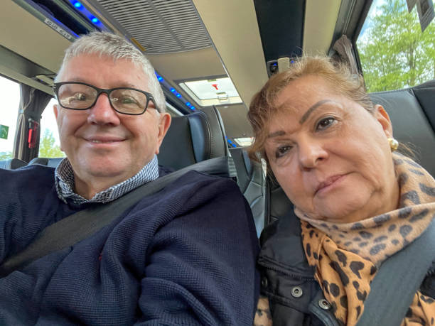 istock Senior couple travelling on a coach 2155111065