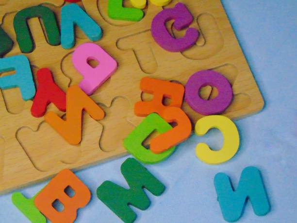 istock Colorful alphabet letter puzzle children's toy 2155111517