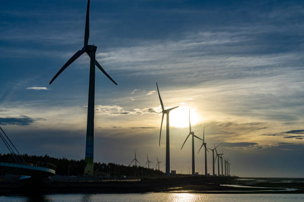 istock Gaomei Wetlands Area wind turbines in sunset time 2155114201