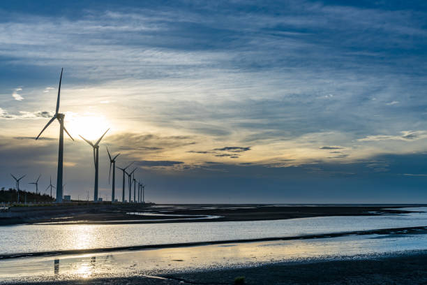 istock Gaomei Wetlands Area wind turbines in sunset time 2155114248
