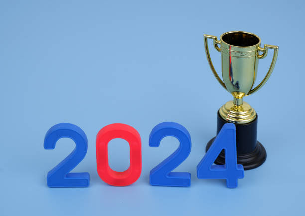 istock Golden champion cup and numbers 2024 on blue background. 2155114893