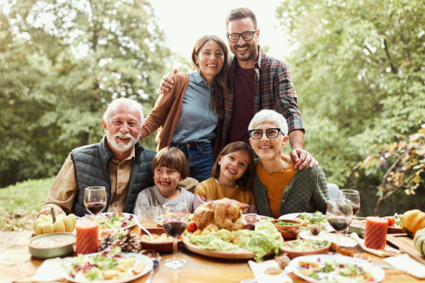 istock Happy multi-generation family enjoying in lunch in nature. 2155114987