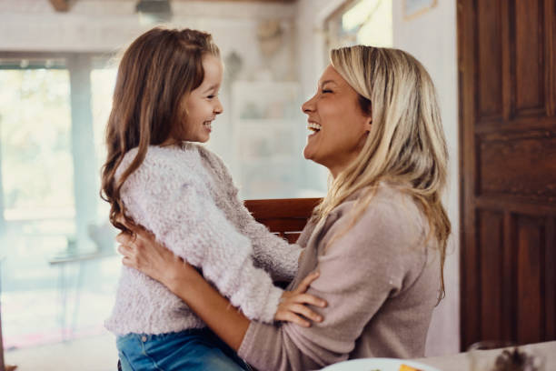 istock Happy single mother and daughter talking at home. 2155115072