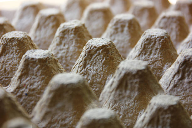 close up old brown paper recycled into egg trays triangle shape abstract background