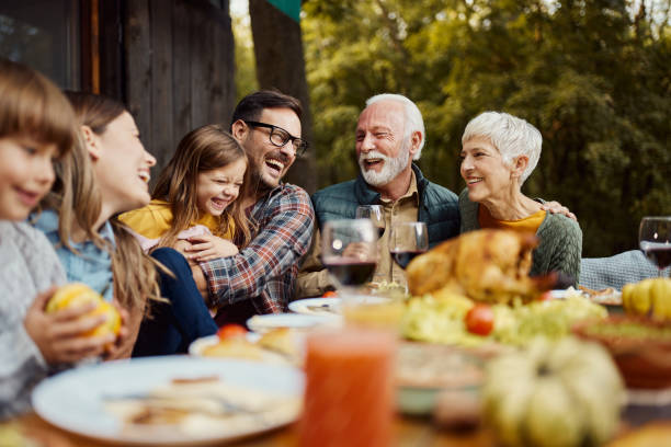 istock Cheerful extended family having fun during lunch on a terrace. 2155116364