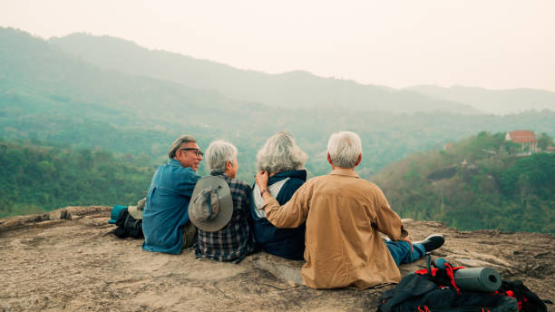 istock Happy multiracial senior  having fun together after hike on the mountain. 2155116805
