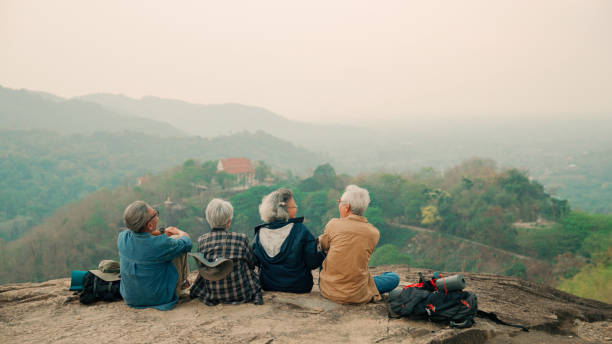 istock Happy multiracial senior  having fun together after hike on the mountain. 2155116818