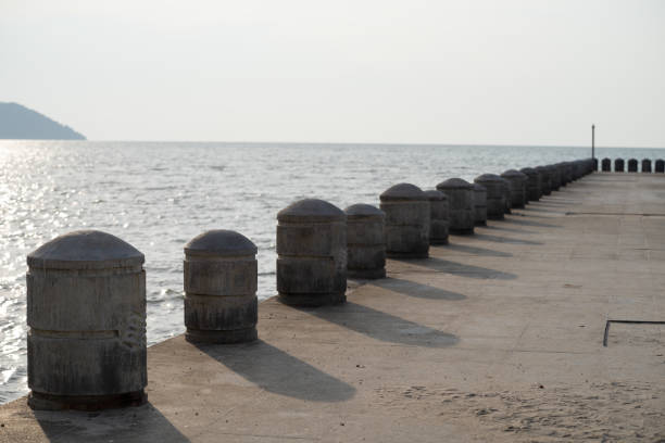 Concrete pole at the pier on a sunny day