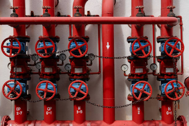 istock Firefighting water pipeline for fire protection system. Water sprinkler and advanced fire alarm systems with control panel in a modern commercial building. 2155120292