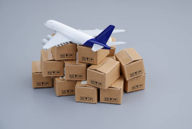 istock Airplane on heap of carton boxes. 2155120480