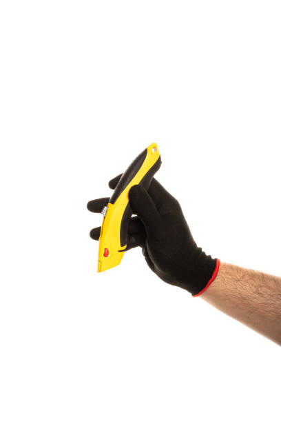 istock Segmented blade or snap-off blade utility knife in male hand isolated on white background. 2155120825