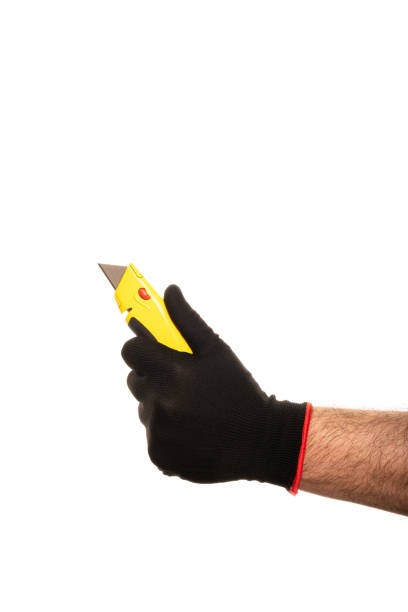 istock Segmented blade or snap-off blade utility knife in male hand isolated on white background. 2155121057