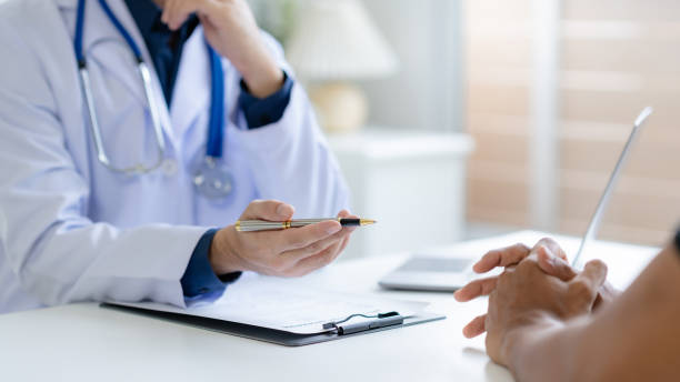 istock Doctor and patient are discussing consultation about symptom problem. Doctor explained the patient's condition and how to care for the patient in detail. 2155121164