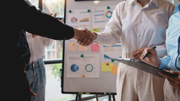 istock Business people shaking hands during a meeting. 2155121807
