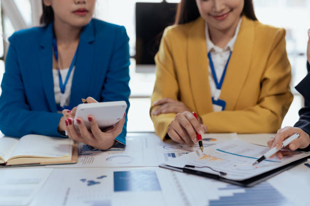 istock Creative asian business woman professionals planning a project in office. Teamwork and collaboration in a modern workplace. 2155122162