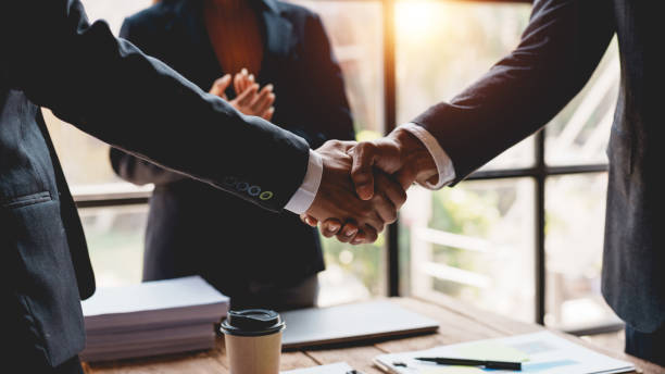 istock Business people shaking hands during a meeting. 2155122337