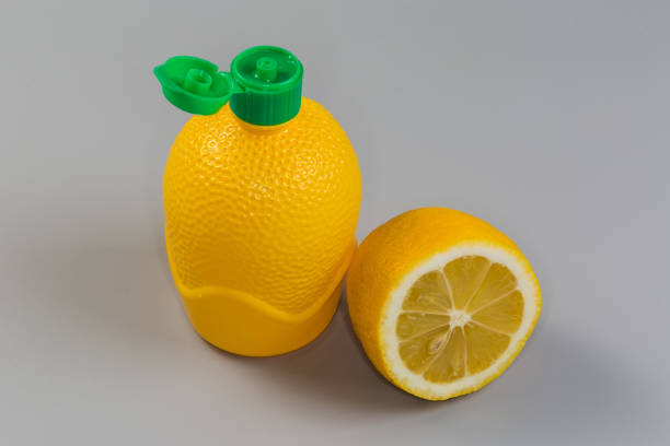 Lemons in a transparent plastic bag on the white background