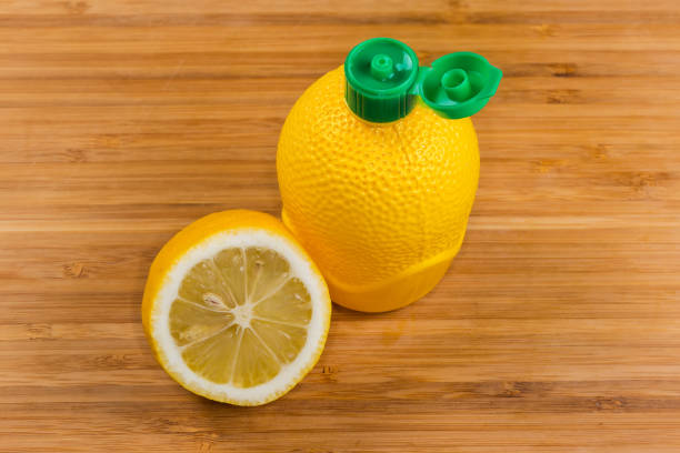 Close-up of a single yellow lemon placed on a clean white background, showcasing the fruit’s vibrant color and natural texture.