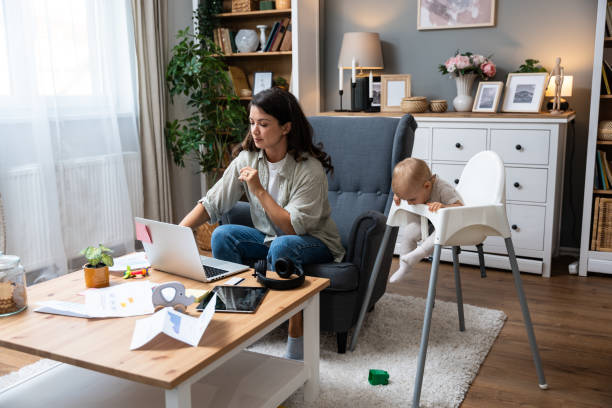 istock Young single divorced mother with baby using laptop computer for video call with her lawyer, talking about ex husband who not paying alimony and expenses and cost of living with small child. 2155124512