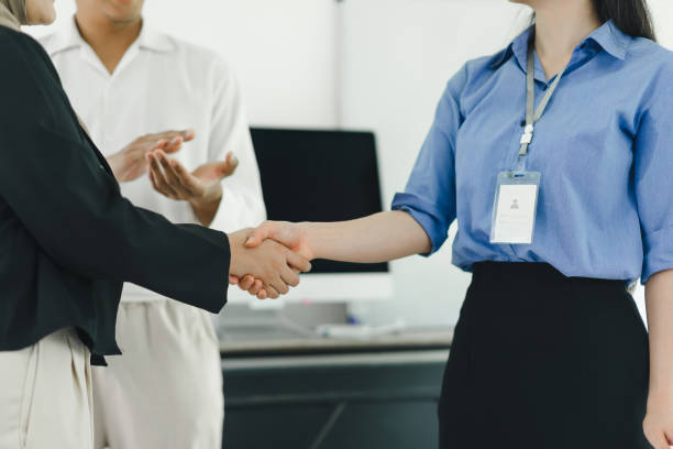 istock Business meeting between colleagues shaking hands in modern office. 2155125648
