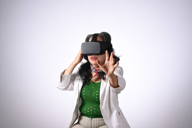 istock Excited senior woman VR headset enjoying virtual reality experience. Futuristic technology concept 2155128635