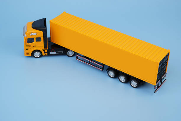 istock Yellow cargo truck on blue background. Copy space for text. 2155128639