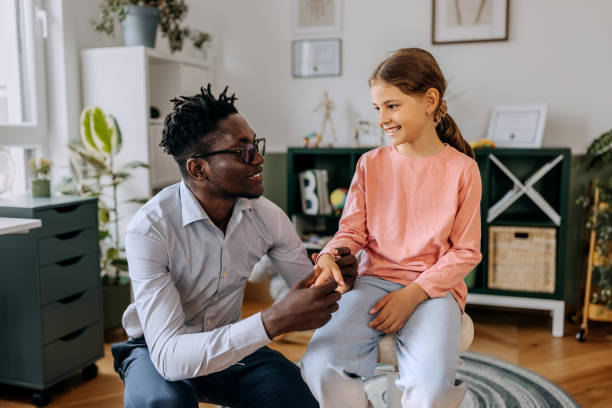 istock Paediatrician examining girl at the office 2155129223