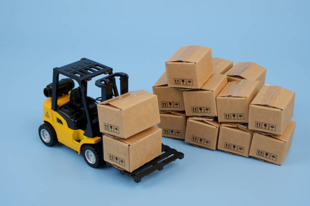istock Forklift with many carton boxes on blue background. 2155129723