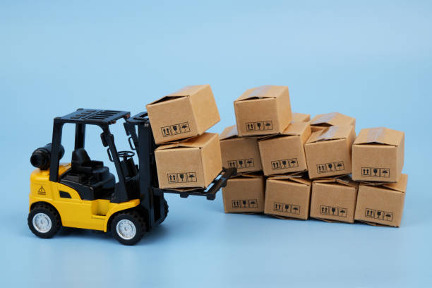 istock Forklift with many carton boxes on blue background. 2155129753