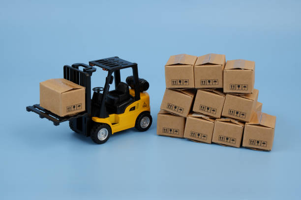 istock Forklift with many carton boxes on blue background. 2155129776