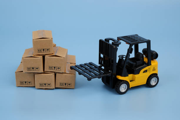 istock Forklift with many carton boxes on blue background. 2155129803