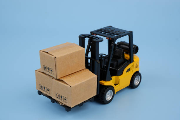 istock Forklift truck carrying carton boxes 2155129911