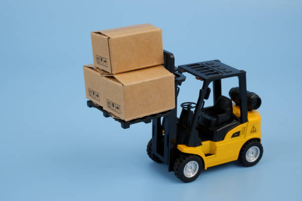 istock Forklift truck carrying carton boxes 2155129949
