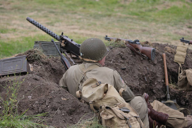 A mixed race individual military female during an outdoor operation in the autumn